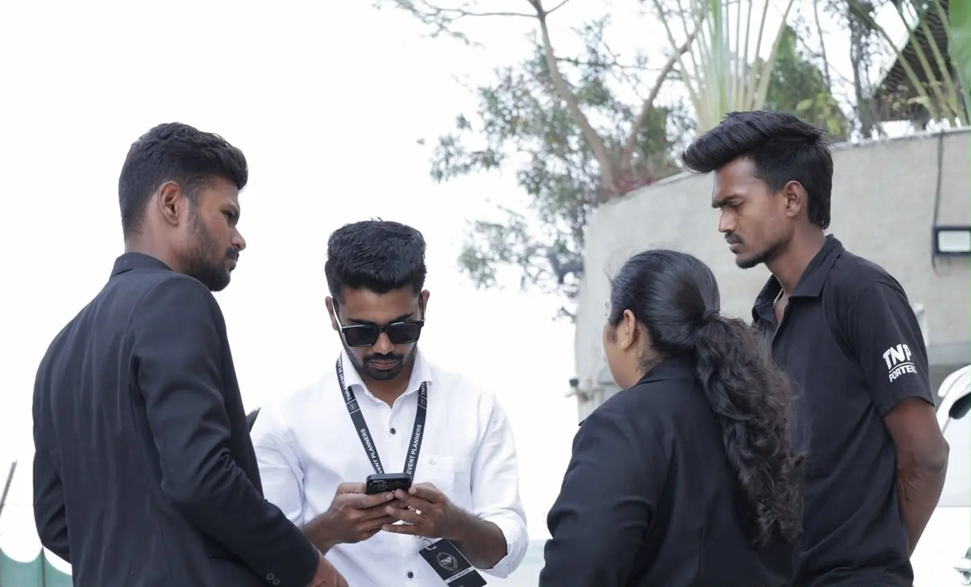 TNP team members checking event details on their phones